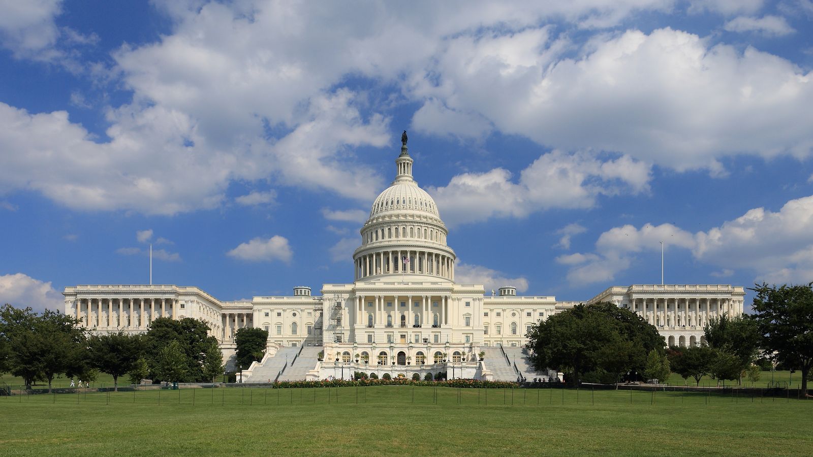 The west front of the United States Capitol under a summer sky